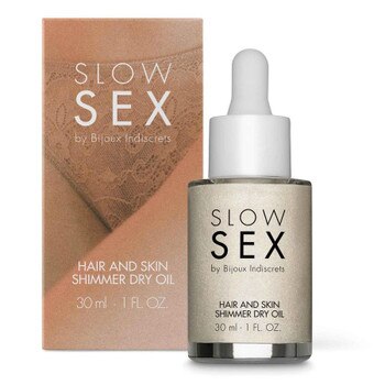 Front View of Bijoux Indiscrets Slow Sex Shimmer Dry Oil bottle and packaging on a white background