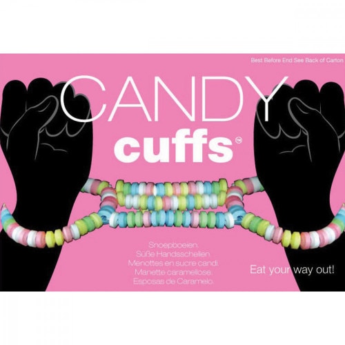 Front View of two hands with candy cuffs on their with a pink background