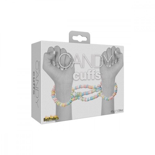 Black and white front view of the candy cuffs packaging with two hands and candy cuff wrapped around them