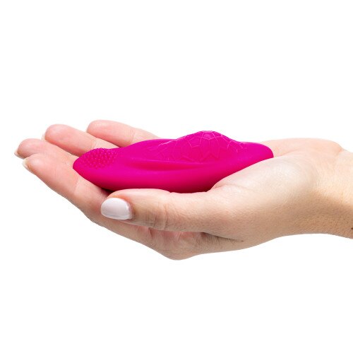Foxy App-Controlled Wearable Panty Vibrator side view in the palm of someone's hands on a white background