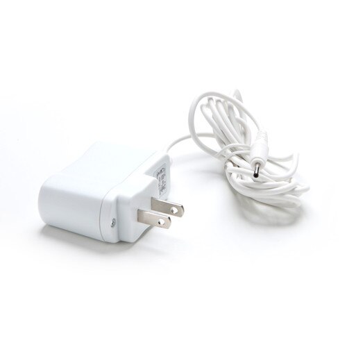 An image of a coiled white wall-outlet charging cable on a white background.