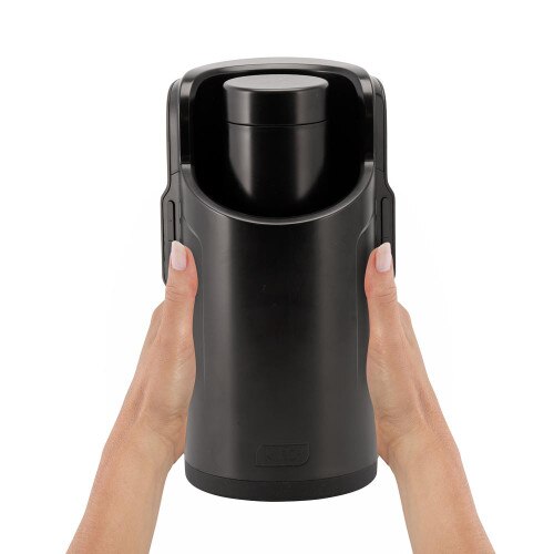Front View of Hands holding the Kiiroo Keon and FeelStroker Set on a White Background
