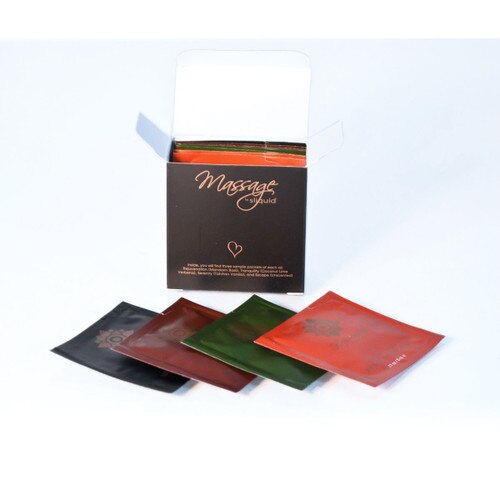 An arrangement of pillow pack samples of sliquid massage oils in front of an open box.