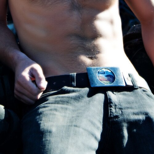 An image of a shirtless man wearing jeans with the black lovebuckle belt.