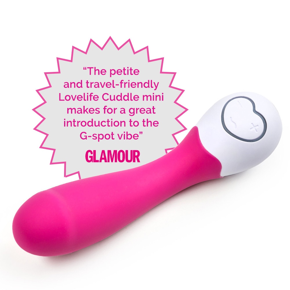 An image of the petite and powerful Lovelife Cuddle Mini flexible g-spot massager in pink lying on on a white background.