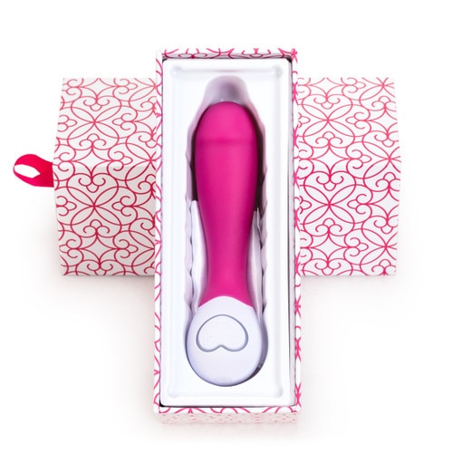 An image of the Lovelife Cuddle mini in pink resting inside its open packaging, the bottom part of the box propped up against the lid. The box is white with pink patterning.