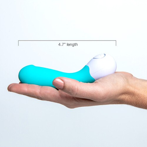 An image of the lovelife cuddle mini lying on its side in the palm of an outstretched hand for scale, a measurement indicating its total length of 4.7 inches.