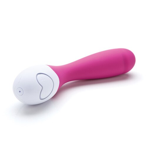 An angled view of the Lovelife Cuddle massager in pink on its side, showing off the USB charging port and the massager's pattern and intensity controls.