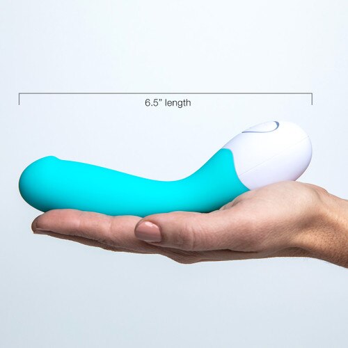 An image of the lovelife cuddle lying on its side in the palm of an outstretched hand for scale, a measurement indicating its total length of 6.5 inches.