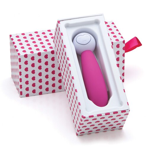 Lovelife Discover sitting in its open box, the bottom portion of the box propped up against the lid behind it. The box is white with a repeating pattern of small pink hearts.