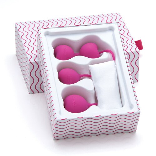 The pink silicone Lovelife Flex weights sit in their gift-ready packaging. The open box is white with a pattern of wavy pink lines.