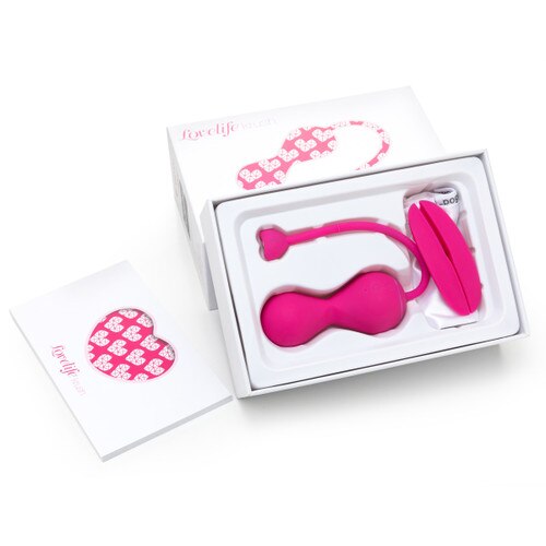 An image of the pink Lovelife Krush and its included accessories in its packaging with the manual resting to the left.