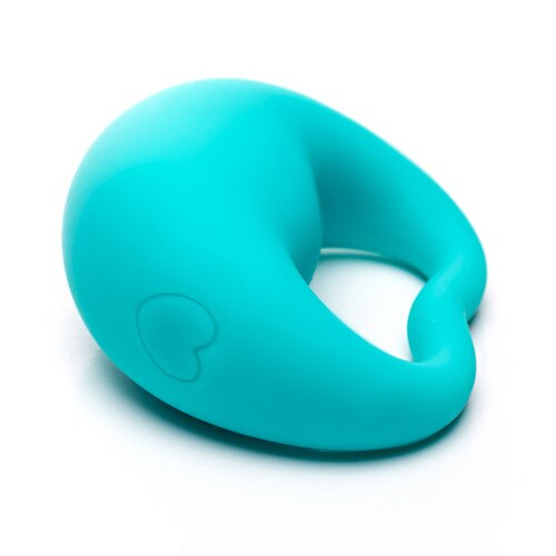 A view of Lovelife Rev from the side as it lies on a white surface The heart-shaped button on the side is visible, to turn the massager on and off and cycle through patterns.