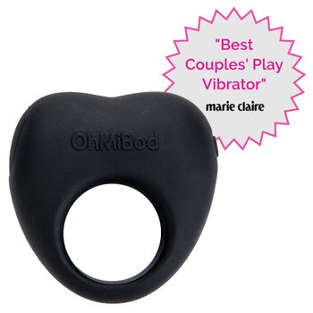 The Lovelife Share couples vibe on a white background. It is black and heart shaped with a center opening. Beside it is a badge that reads "best couples play vibrator" and the logo of marie claire.