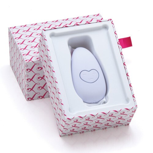 An image of Lovelife Smile resting inside its open packaging, the base of the box propped up against the lid. The box is white with a repeating pink pattern of the stylized Lovelife L.