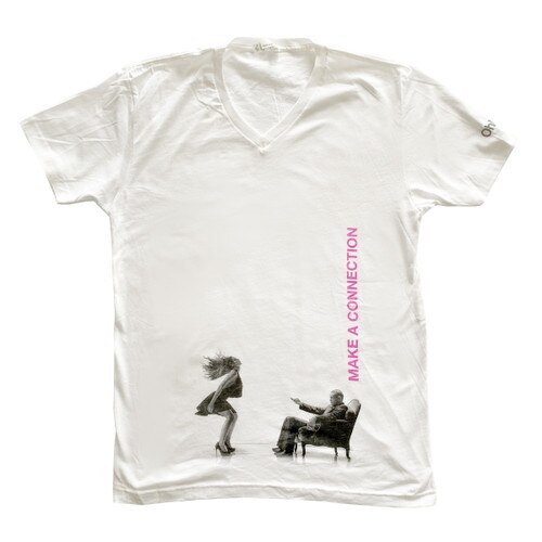 An image of a white v-neck t-shirt with the ohmibod logo on the left sleeve and a black and white image of a man and woman using the Nex 1 across the belly, with "make a connection" in pink