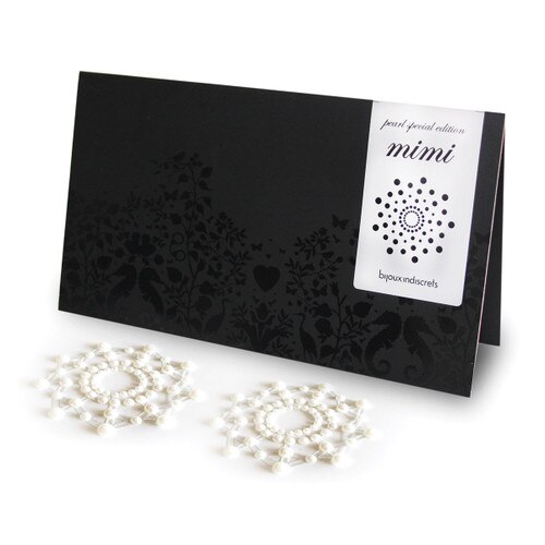 An image of a pair of pearl pasties arranged in a starburst shape next to their black and red packaging.