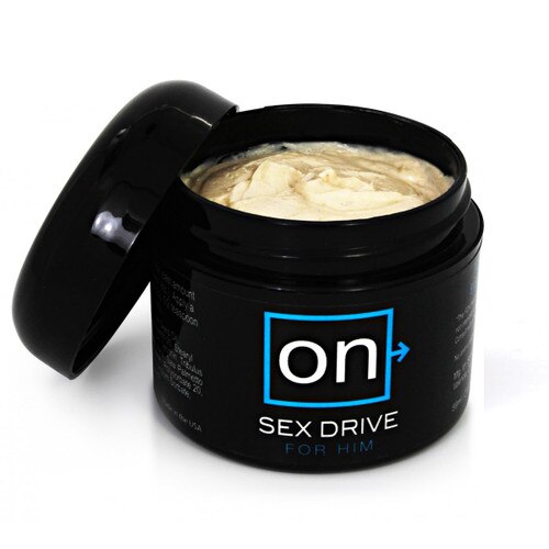 An open round black jar of ON sex drive for him revealing a pale yellow thick cream.