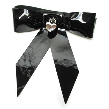 Wrist restraints shaped with a patent leather black bow sealed with a small heart shaped padlock.