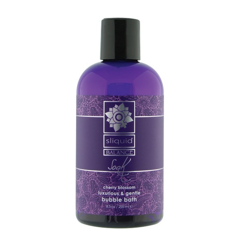 An image of a purple 8.5oz bottle of Sliquid Balance Soak bubble bath with a black cap on a white background. The fragrance is cherry blossom.