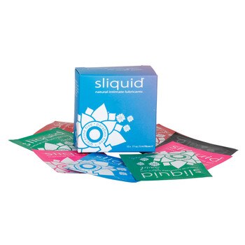A blue box of Sliquid lubricant samples, with sample pillow packs lying around it on a white background.