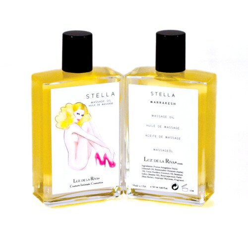 A clear bottle with a black cap of golden-colored Stella Massage Oil in Marrakesh, viewed front and back.