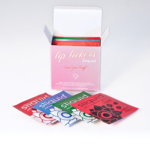 An arrangement of pillow pack samples of sliquid swirl lubricants in front of an open box.