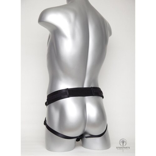 A rear view of a silver mannequin wearing the black Deuce harness, demonstrating where the straps sit on the hips and under the buttocks.