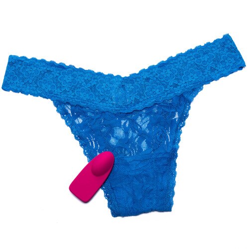 An overhead image of the Bluemotion Nex 1 slim line panty vibe resting on a blue lace panty with a positioning pouch for the massager sewn in.