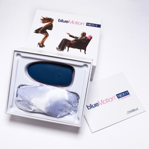An image of the Bluemotion Nex 1 bluetooth enabled massager in its packaging with the manual beside it.